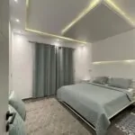Villa Diamant — Chambre, Lit double, rideaux et plafond lumineux | Ethic Village Djerba