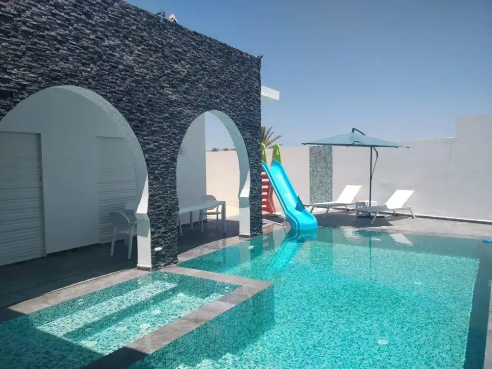 Villa Diamant — Pool, Slide, paddling pool, stone arches and sun loungers | Ethic Village Djerba