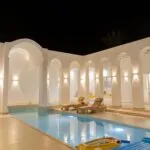 Villa Jade — Pool, Night view, arches, sun loungers and lighting | Ethic Village Djerba