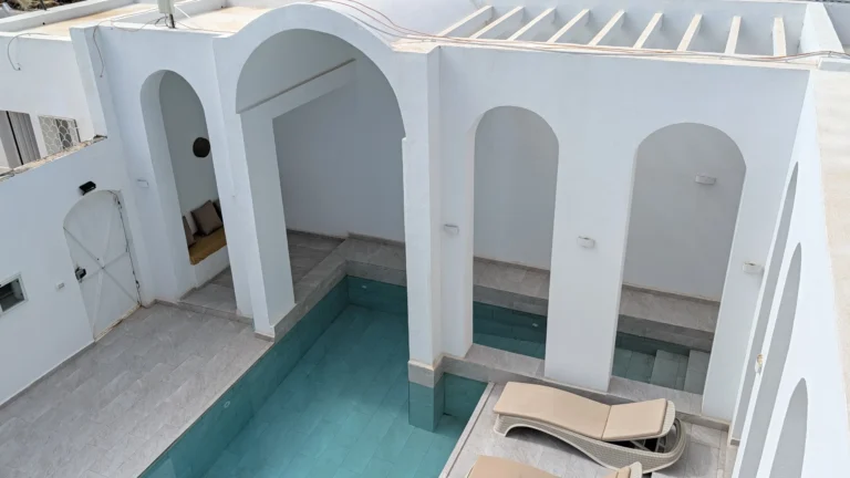 Aerial view of Villa Jade's pool and arched terrace